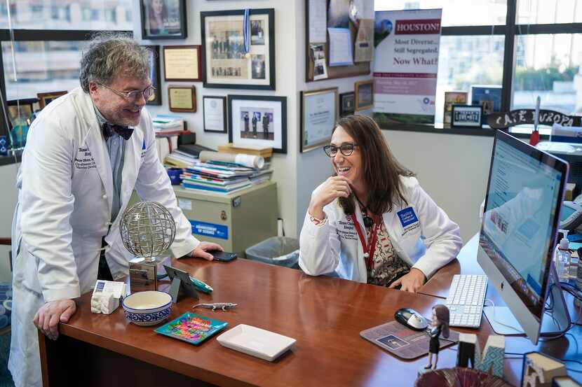 Dr. Peter Hotez and Dr. María Elena Bottazzi chat in her office on Dec. 16 at Texas...
