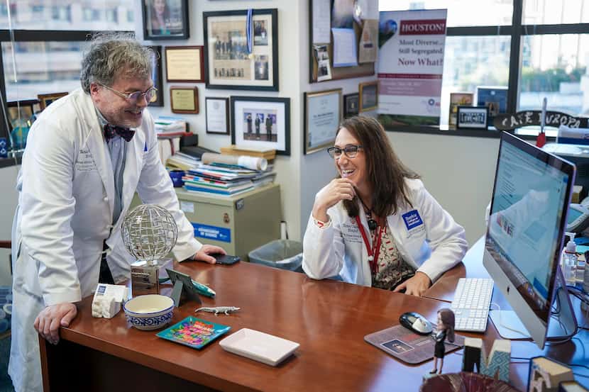 Dr. Peter Hotez and Dr. María Elena Bottazzi chat in her office on Dec. 16 at Texas...