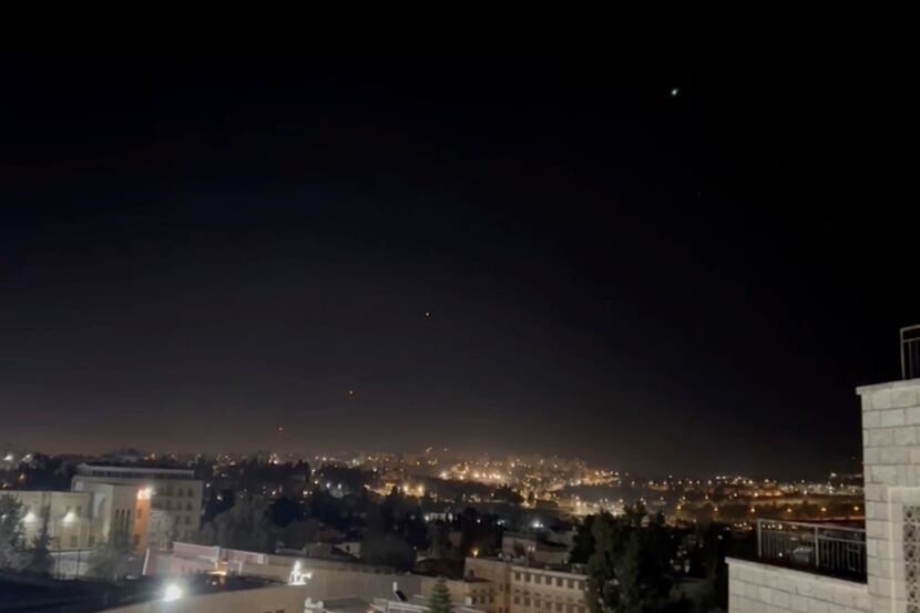 Interceptors missiles are launched into the sky early Sunday, April 14, 2024, in Jerusalem....