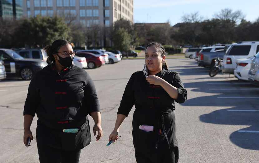 Jonnay Mckinley and her sister, Kelechi Young (left) head to work at P.F. Chang's on Monday,...
