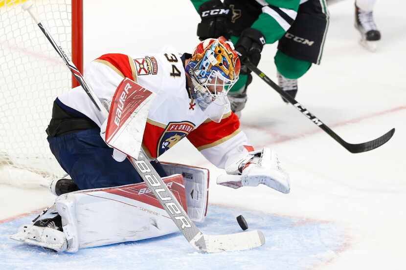Dallas Stars center Justin Dowling (37) tries to get the puck past Florida Panthers goalie...