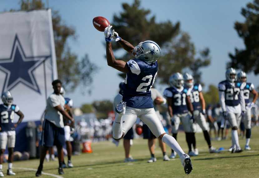 Dallas Cowboys defensive back Josh Thomas (26) misses a short pass during afternoon practice...
