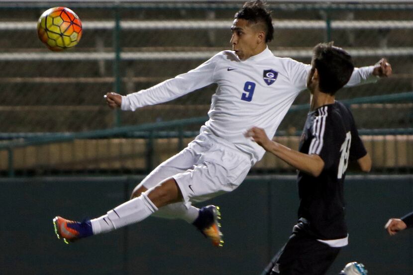Grand Prairie's Alejandro Medina (9) exhibits great focus as he makes a high flying shot on...