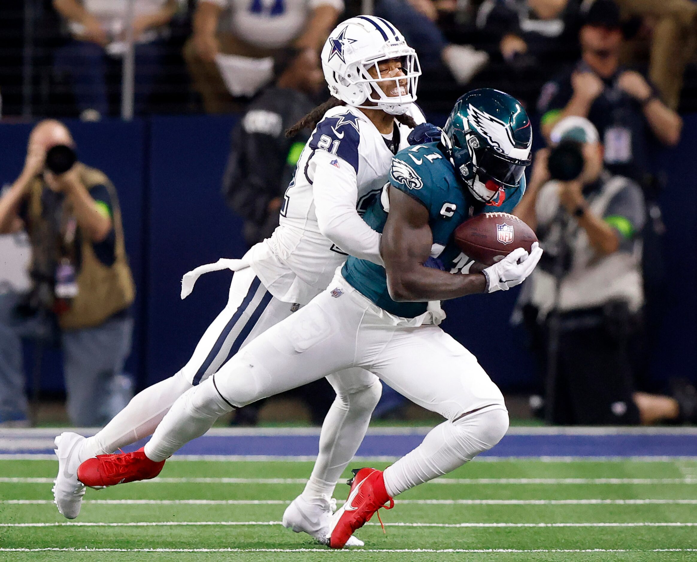 Philadelphia Eagles wide receiver A.J. Brown (11) catches a pass in front of Dallas Cowboys...