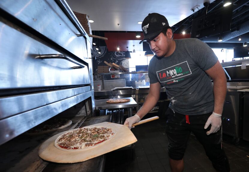 Juan José Orosco makes pizza at In-Fretta in Plano on April 2, 2020.