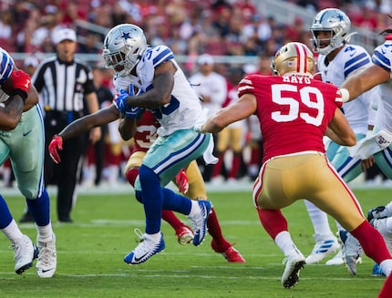 Cowboys running back Tony Pollard (36) finds a hole during the first quarter of a preseason...