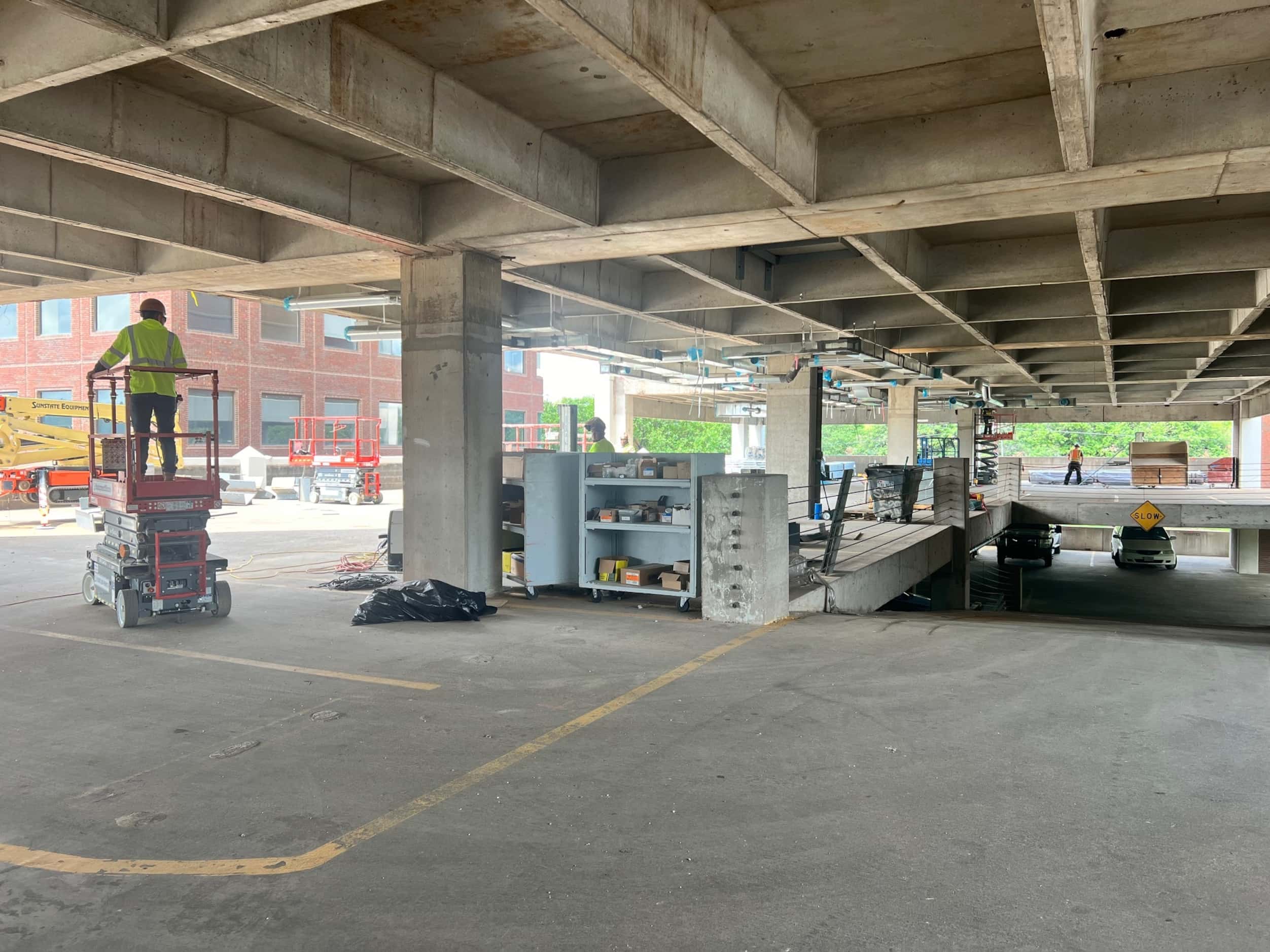 The top level of the parking garage is being rethought as an athletic court and...