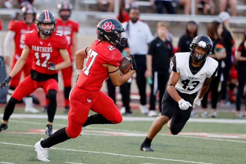 Colleyville Heritage's Riley Wormley  (27) runs a kick back 63 yards as Euless Trinity’s...