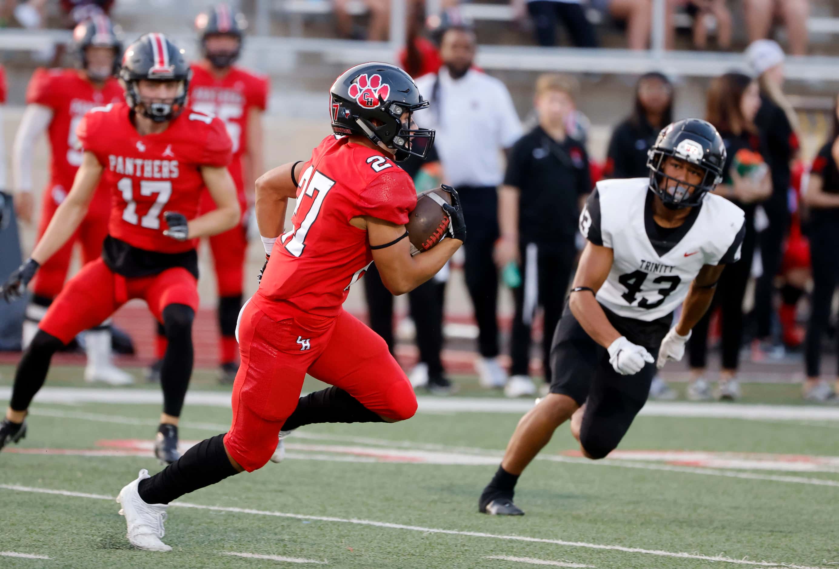 Colleyville heritage player Riley Wormley  (27) runs a kick back 63 yards as Trinity’s...