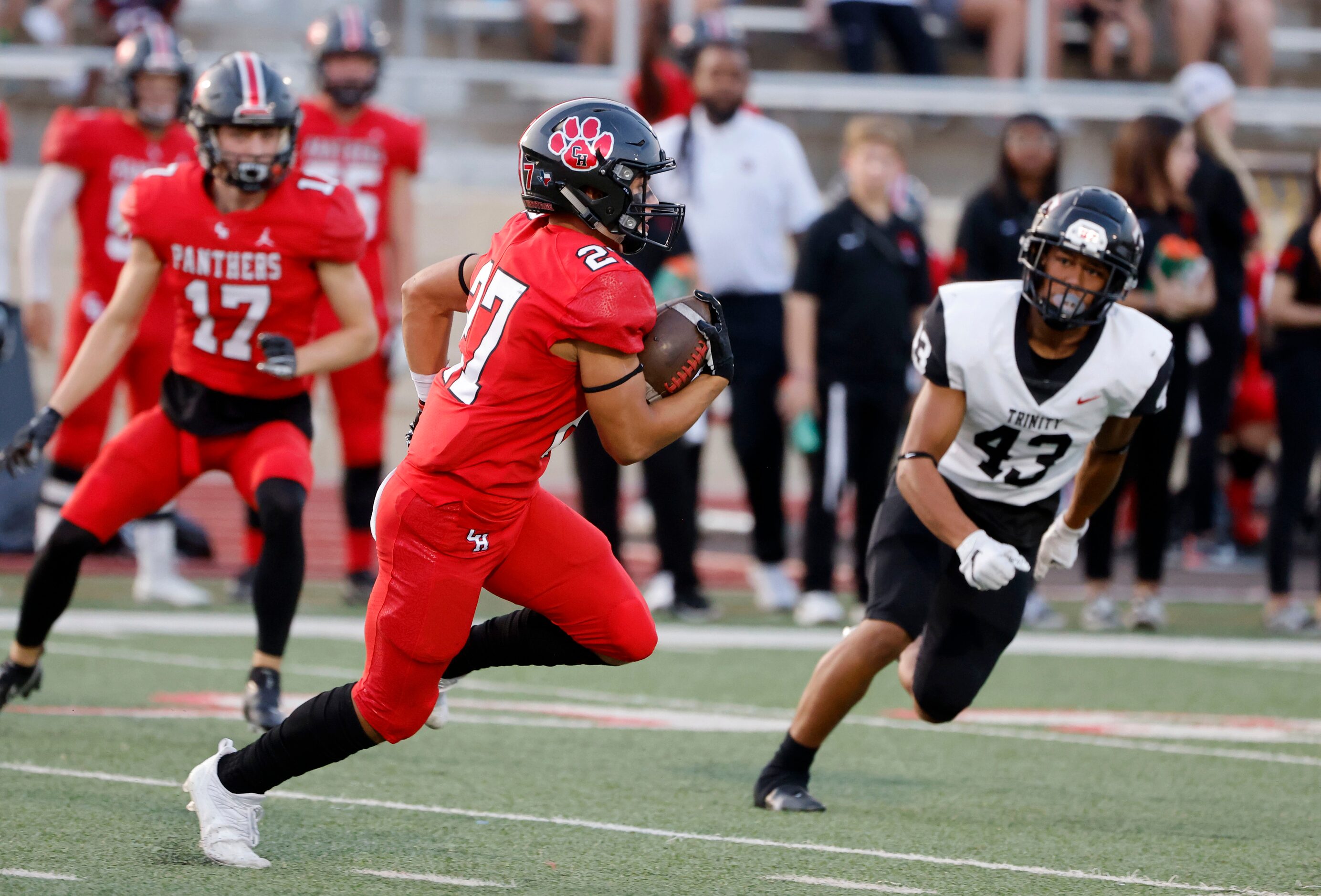 Colleyville heritage player Riley Wormley  (27) runs a kick back 63 yards as Trinity’s...