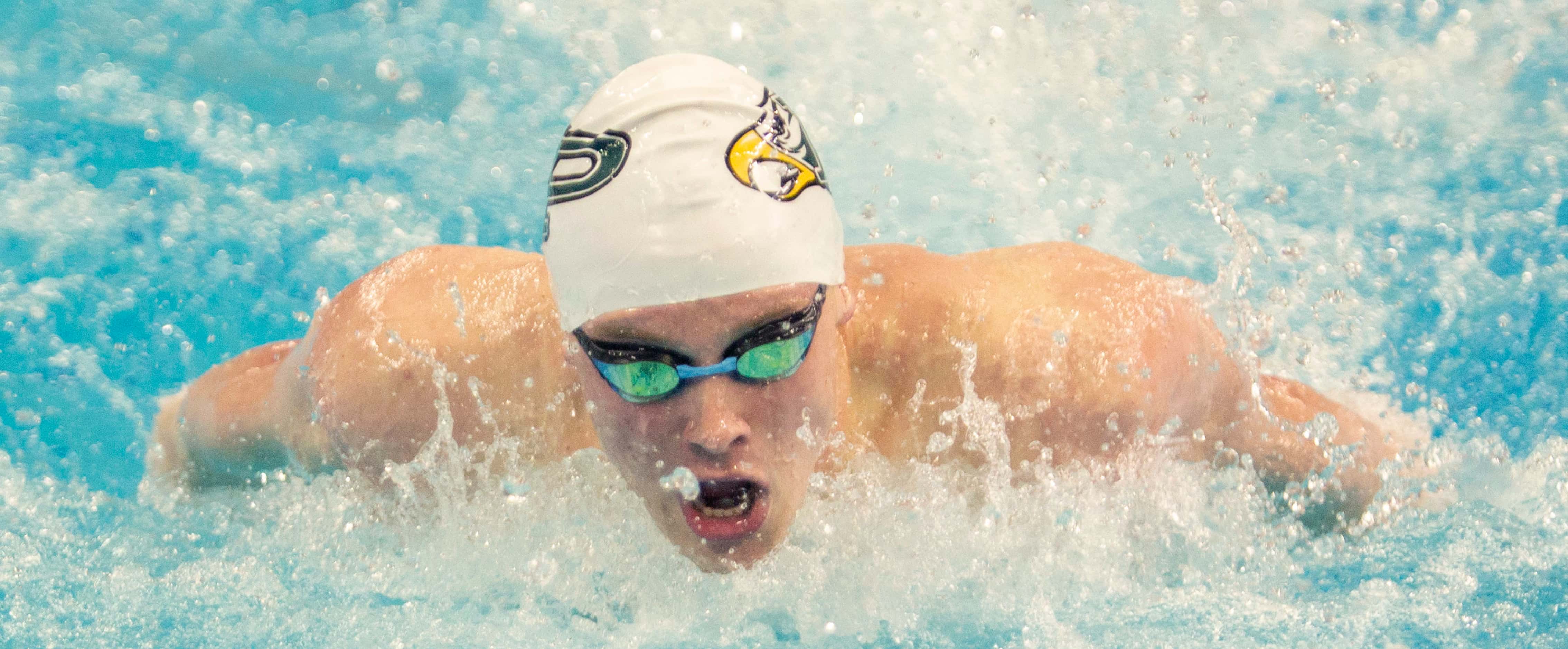 Prosper's Jacob Wimberly competes in the boys 100-yard butterfly during the 6A swimming and...