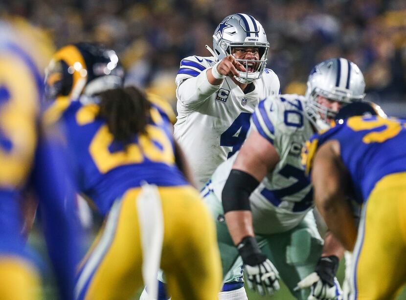 Cowboys quarterback Dak Prescott (4) calls out a signal during the fourth quarter of their...