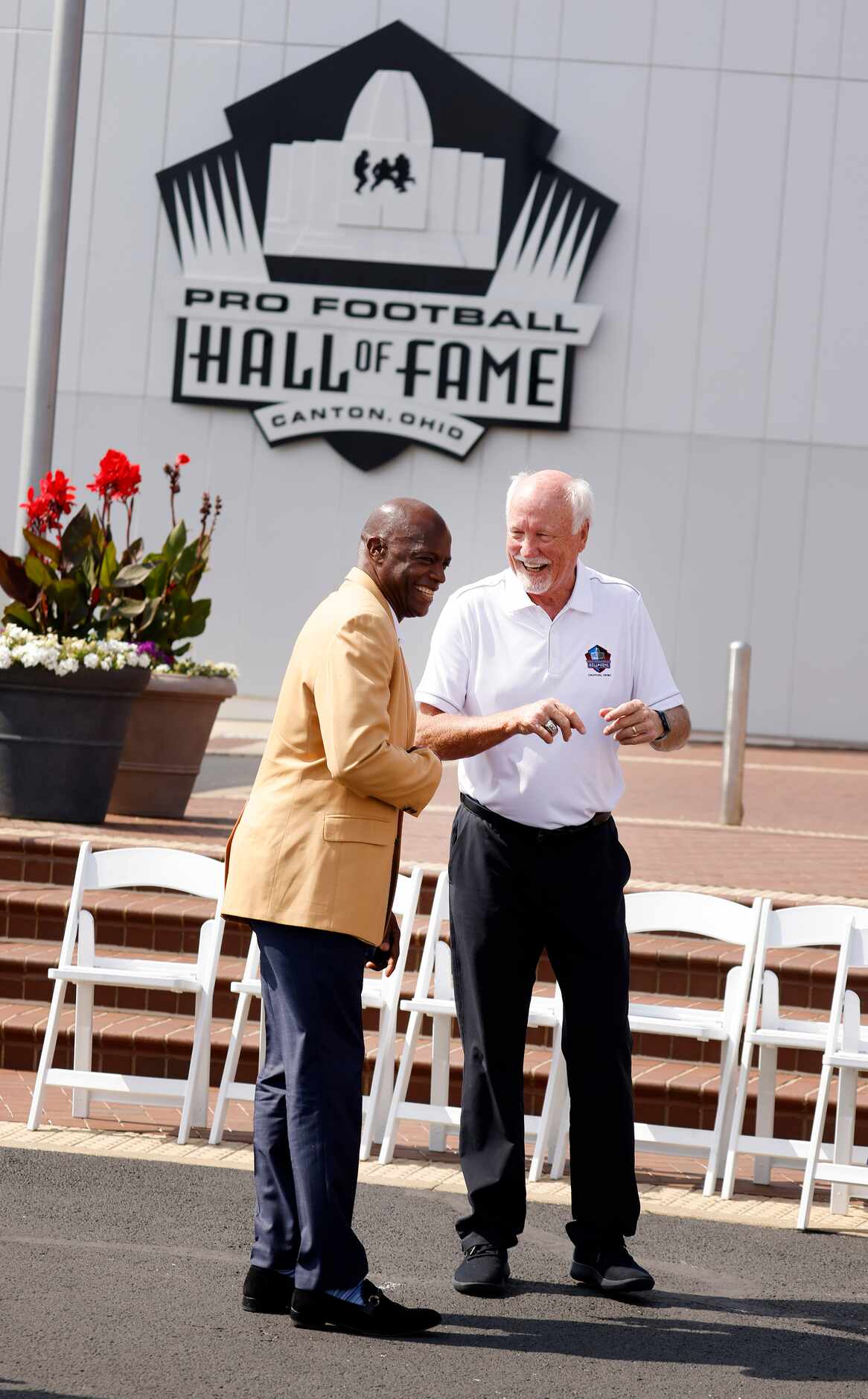 Pro Football Hall of Fame inductee Cliff Harris of the Dallas Cowboys (right) visits with...