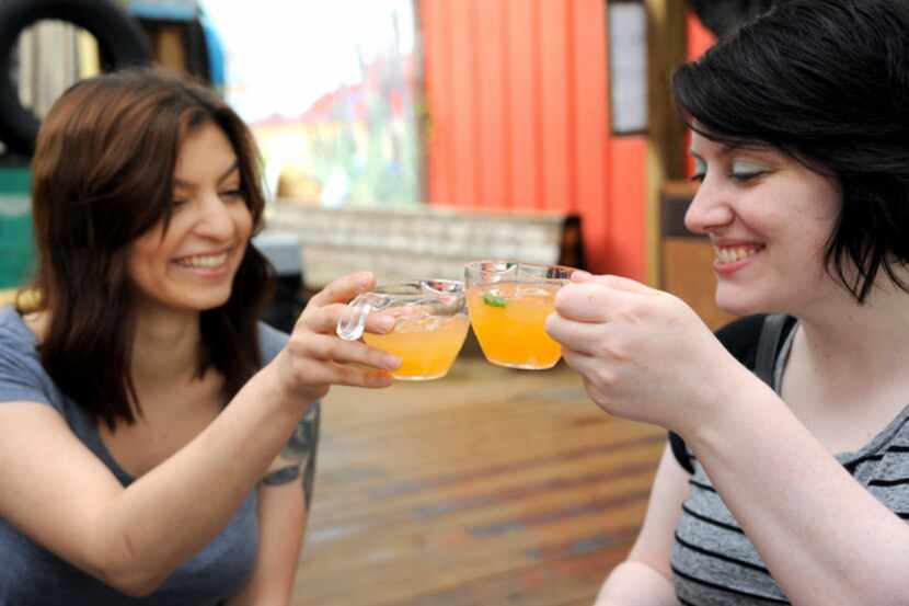 Grace Rozas and Christie Graves toast with brunch punch at Truck Yard in Dallas.