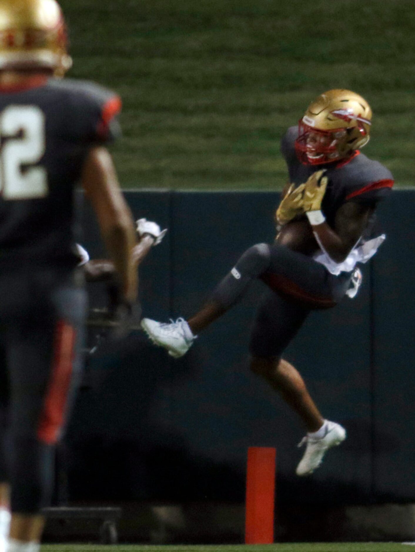 South Grand Prairie receiver Deamikkia Nathan (8) skies to pull in a receiving touchdown...