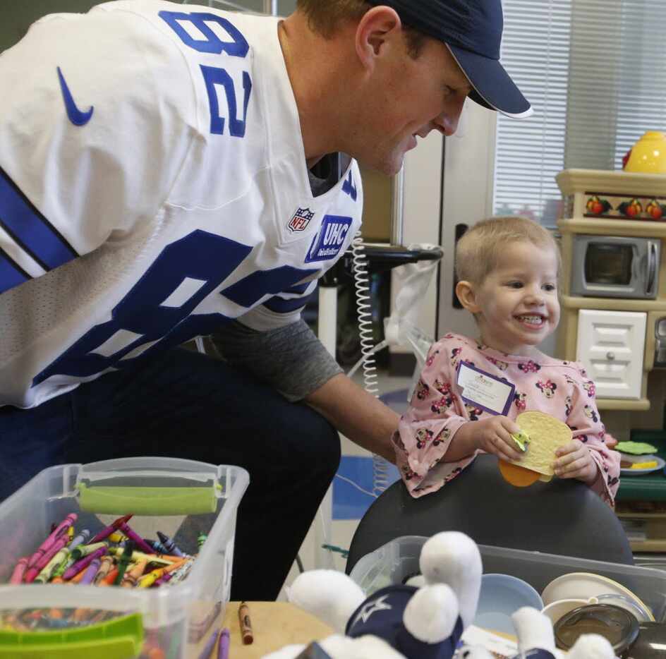 Cowboys tight end Jason Witten gets a big smile from Taylor Sessions as the Dallas Cowboys...