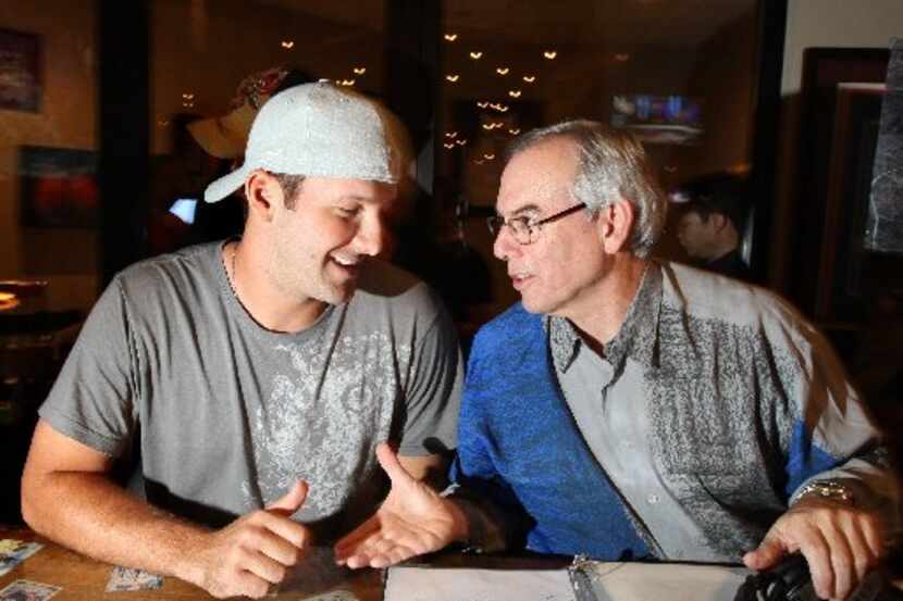 Tony Romo, left, of the Dallas Cowboys and host Brad Sham chat before the start of a live...