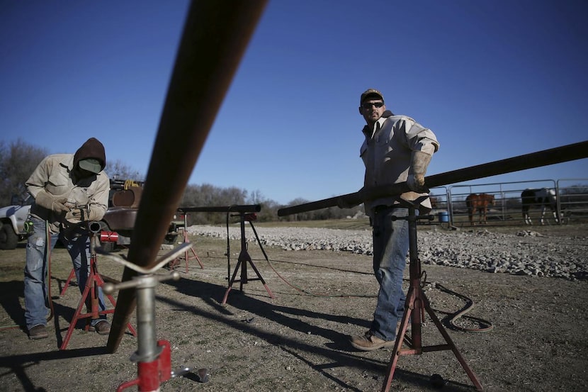 
Independent welders Justin Jordan (left) and Shawn Ovalle constructed an entryway at the...