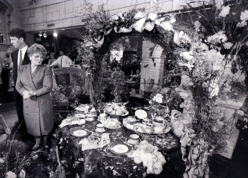 Sharon De Garmo of Dallas' office of international affairs checks over the tea service to be...