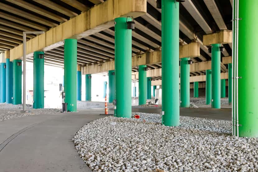 New pathways, paint, lighting and a hardscape have been installed underneath the highway and...