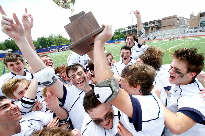Members of the Episcopal School of Dallas lacrosse team break out in euphoria after being...