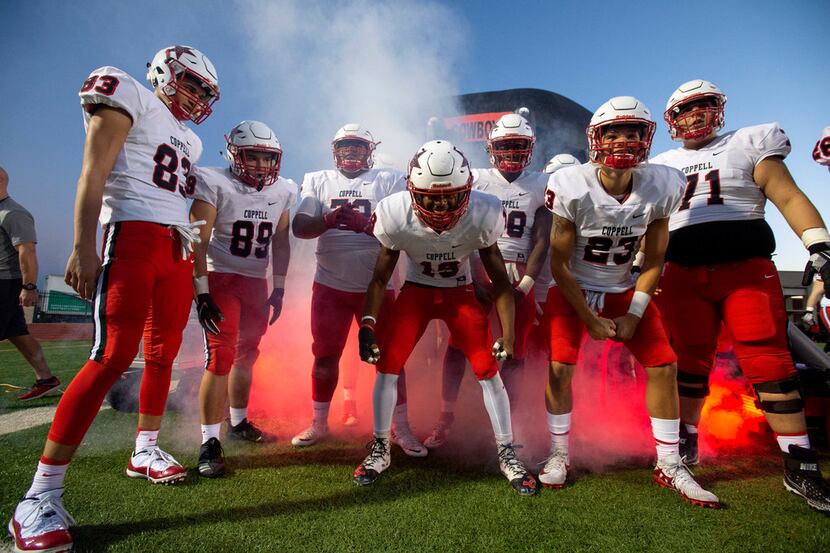 The Coppell Cowboys prepare to take the field against Irving before a high school football...
