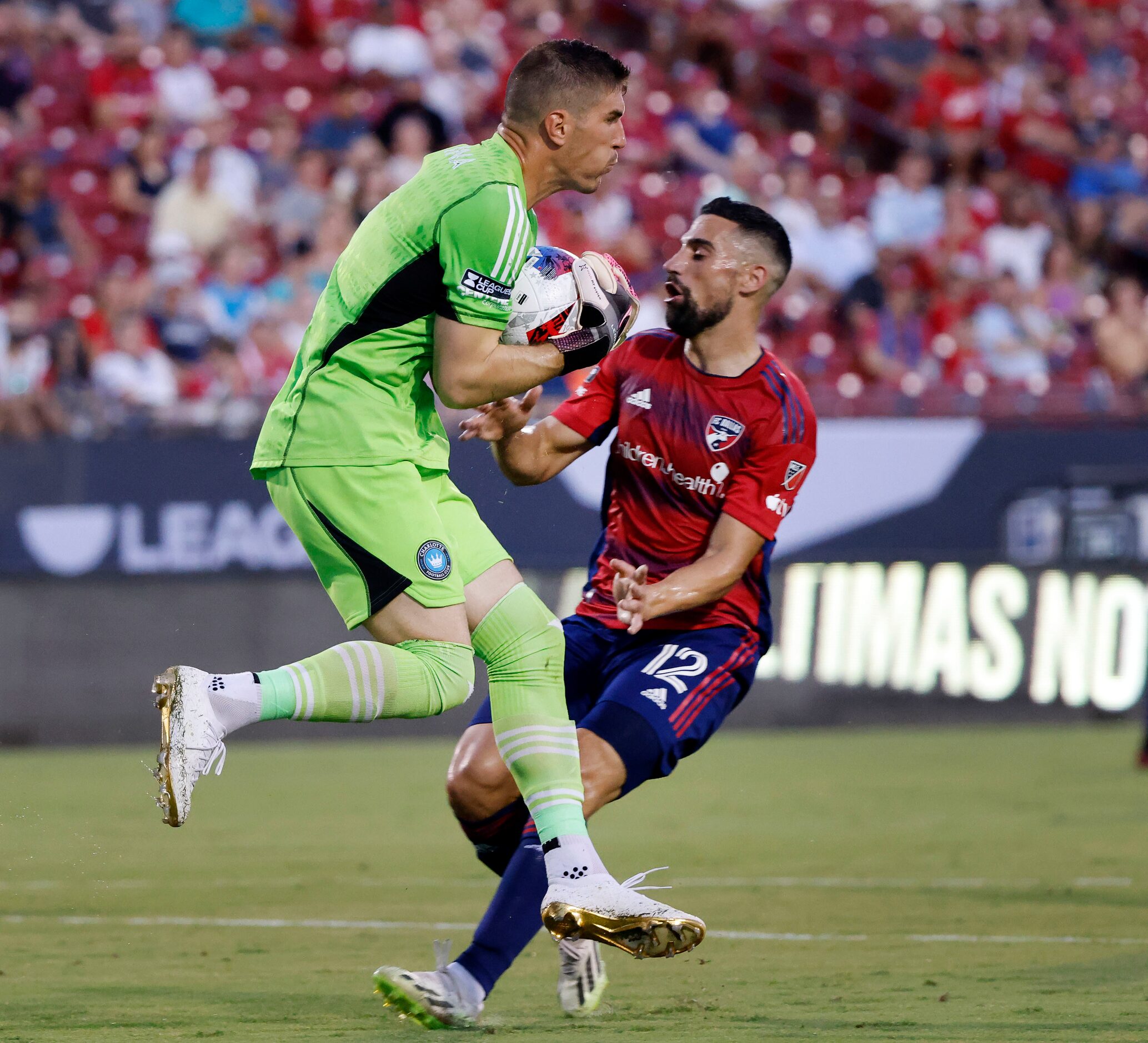 Charlotte FC goalkeeper Kristijan Kahlina (1) catches the ball as FC Dallas midfielder...