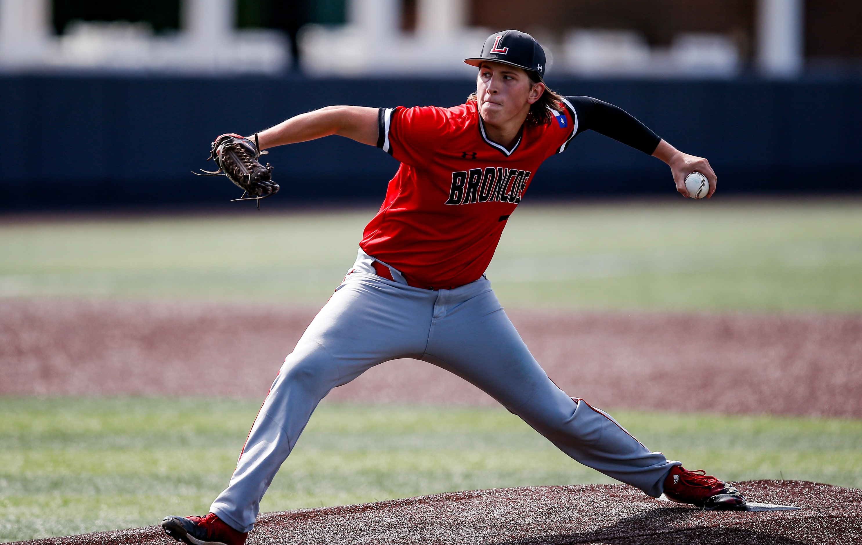 Mansfield Legacy pitcher Drake Dowd throws during the first inning of a high school Class 5A...