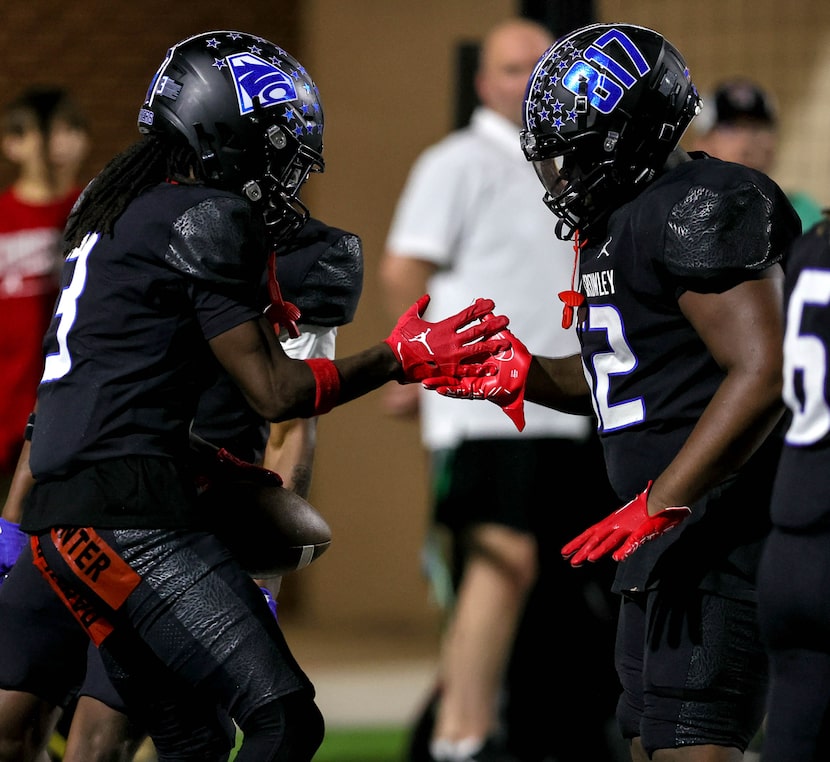 North Crowley wide receiver Dekoryian West-Davis (3) celebrates with offensive lineman Kaleb...