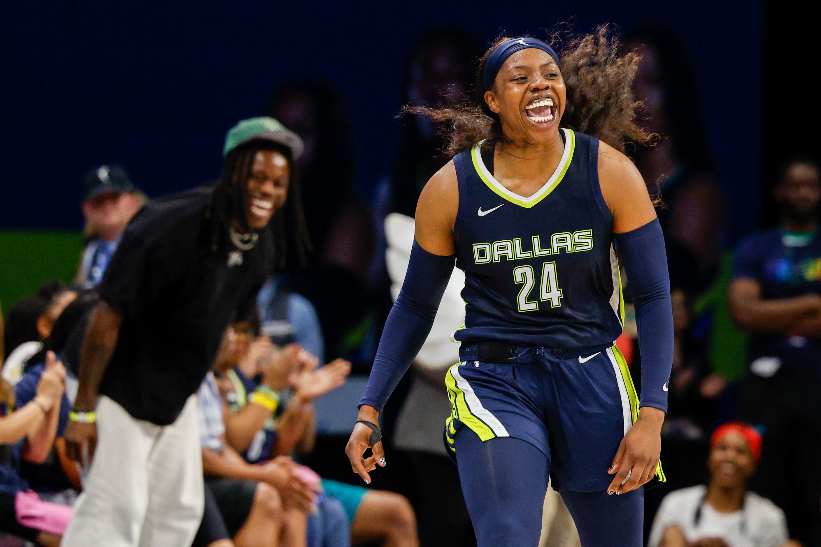 Dallas Wings guard Arike Ogunbowale (24) celebrates after a basket during the second half...