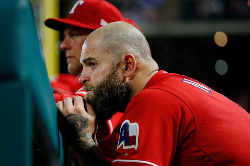 Texas Rangers first baseman Mike Napoli (5) watches the game in the ninth inning against the...