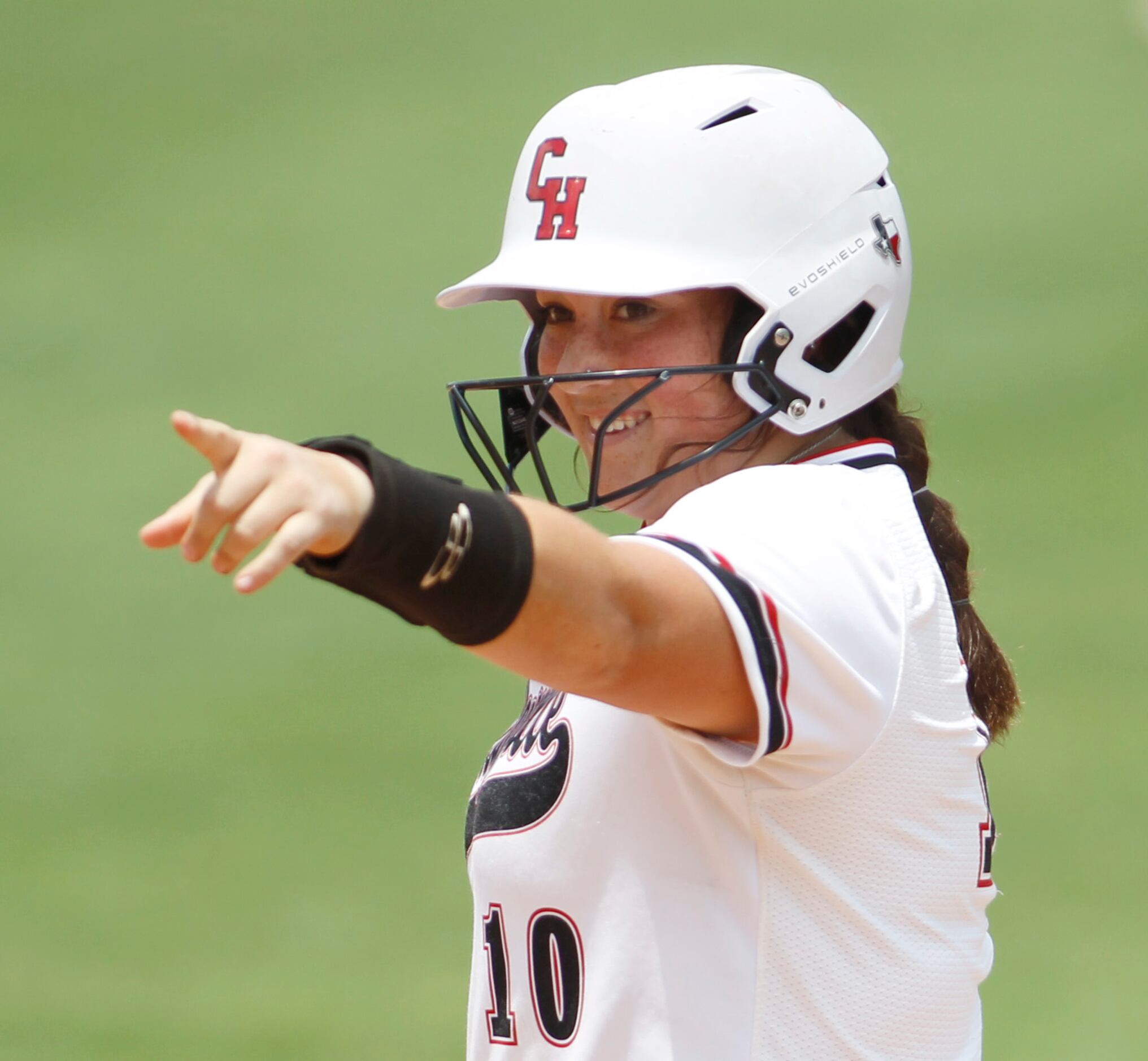 Colleyville Heritage in fielder Luna Flores (10) gestures to the dugout after reaching 2nd...