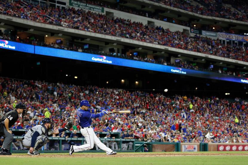 Texas Rangers catcher Robinson Chirinos (61) hits a home run against Tampa Bay Rays during...