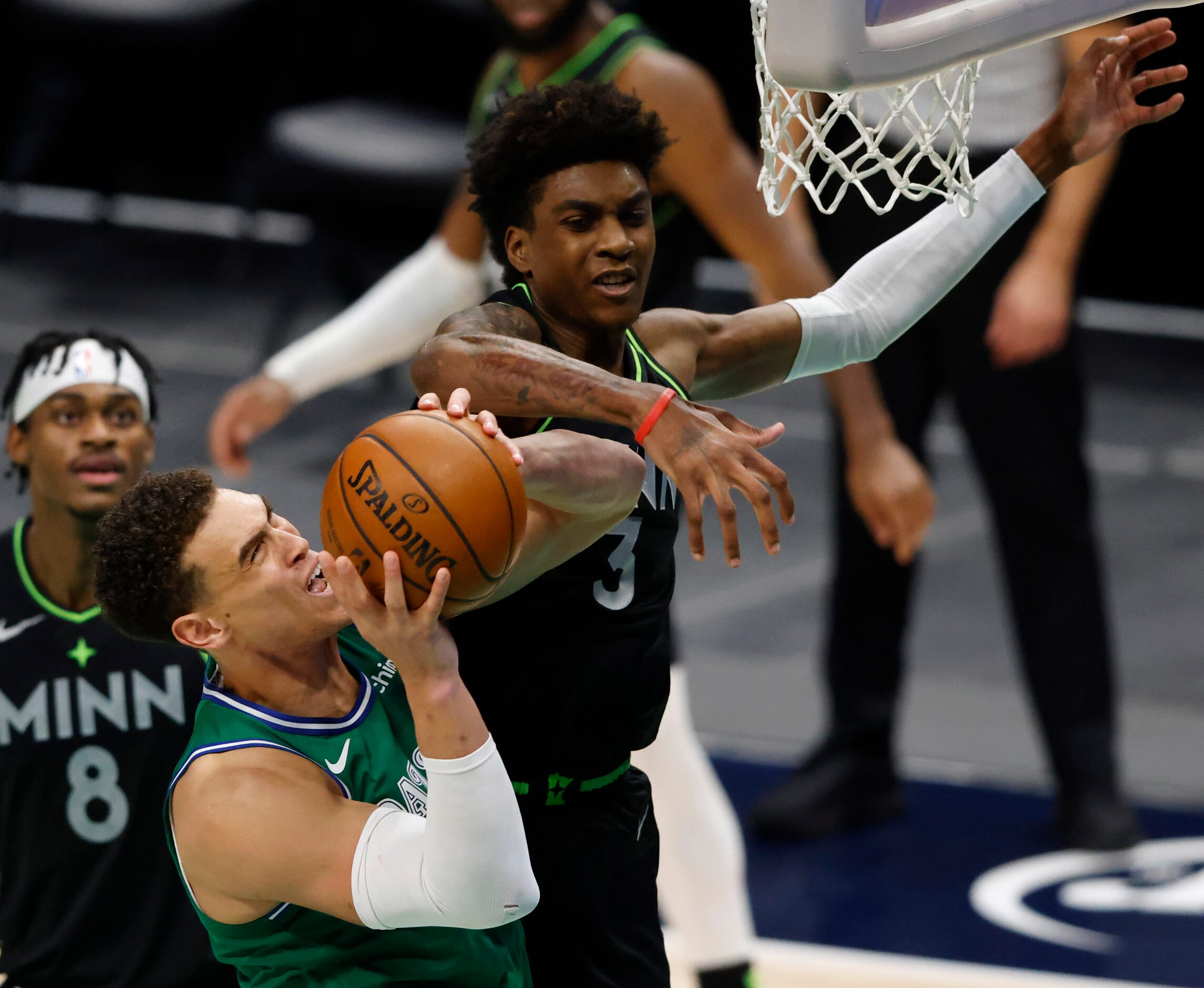 Dallas Mavericks center Dwight Powell (7) is fouled by Minnesota Timberwolves forward Jaden...