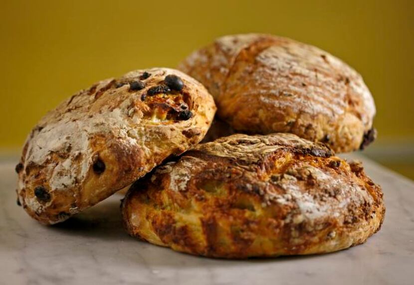 
Add-in versions of Crackling Artisan Bread include (clockwise, from left) raisin, cranberry...