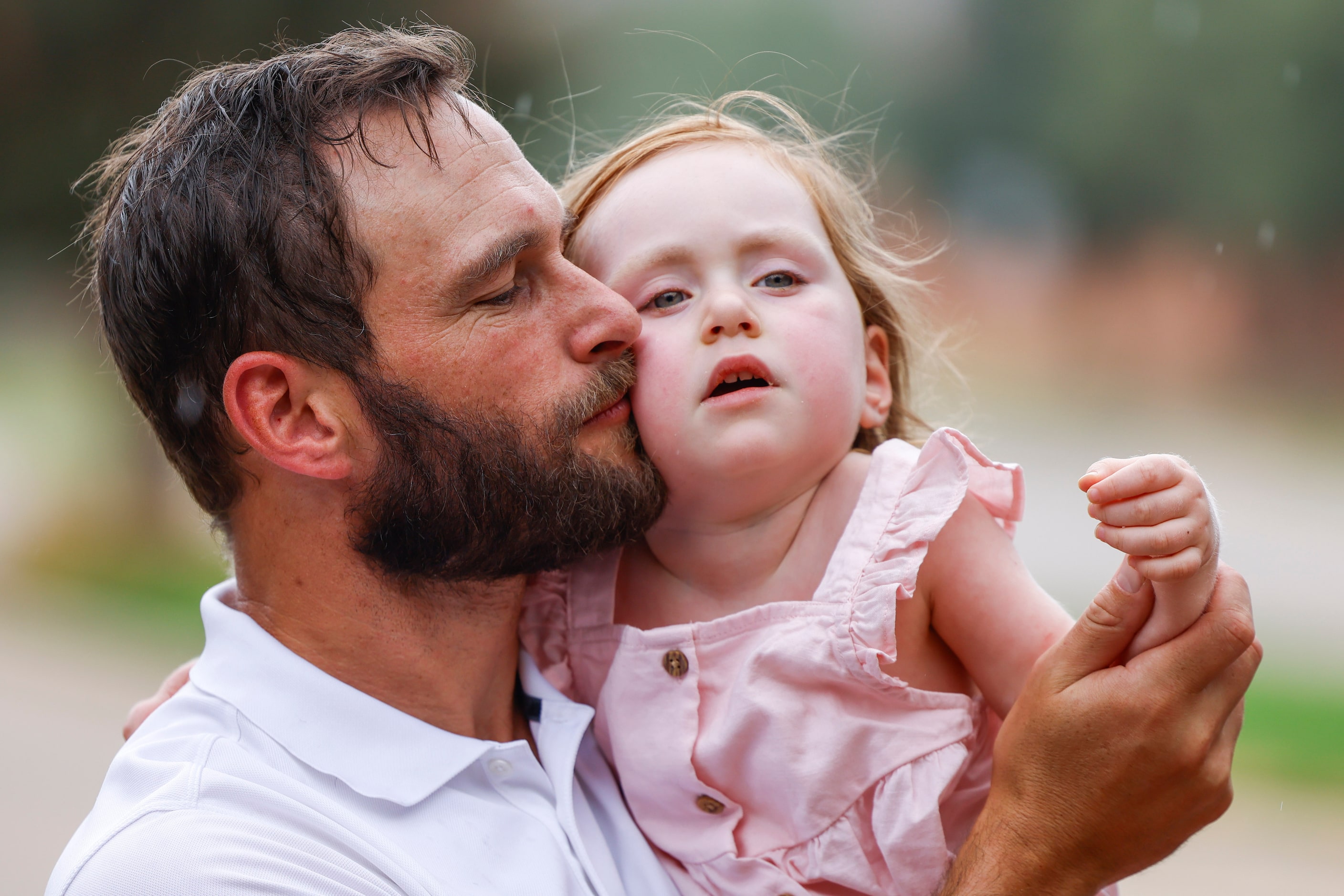 Nick Ashwin kisses his daughter Delta after a photo session on Sunday, Sept. 3, 2023 in...