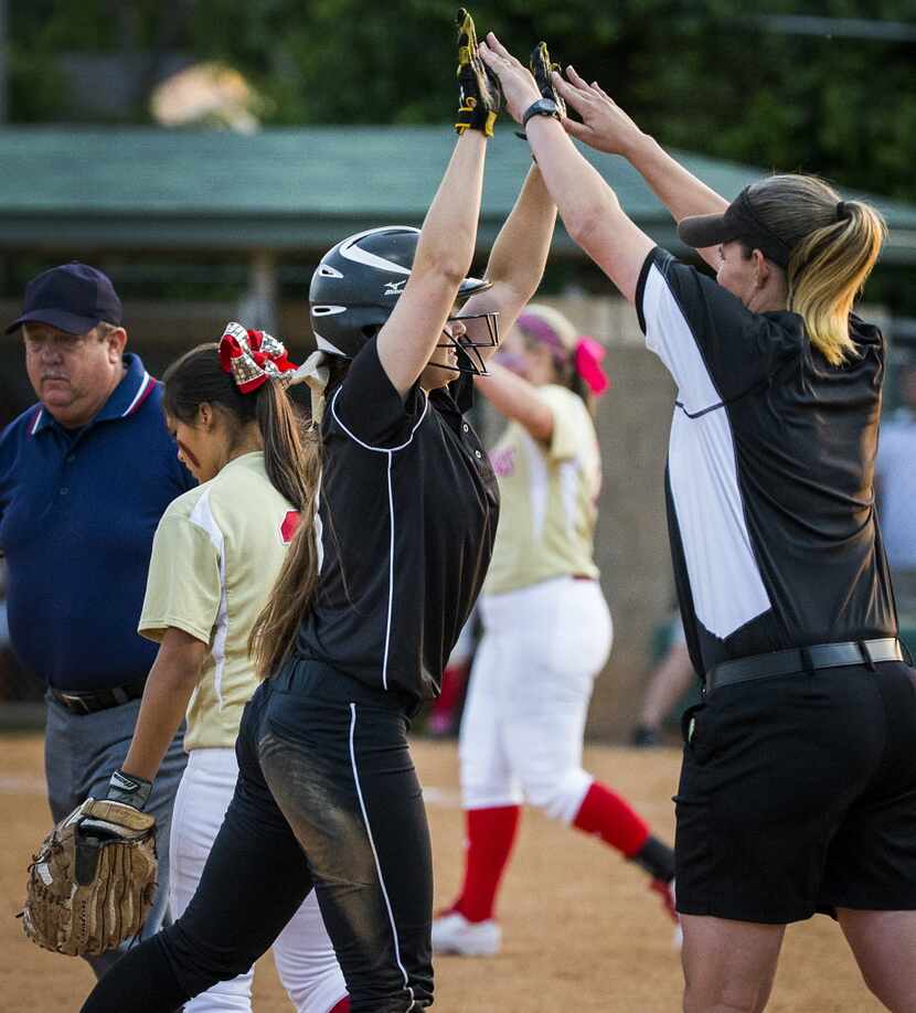 Mansfield coach Jennifer Haltom (right), pictured here in a game in April of 2015, saw her...