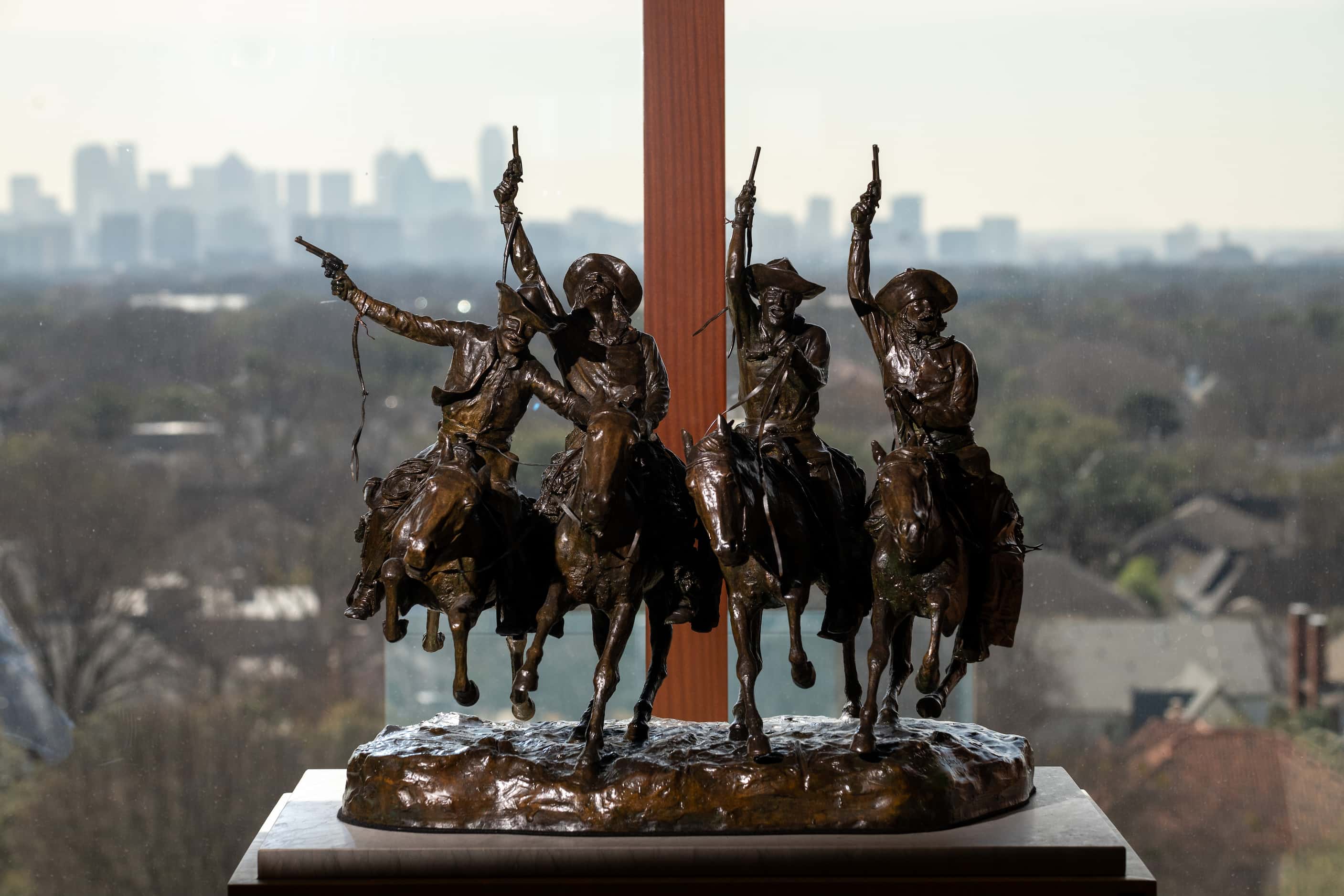 
A bronze modeled sculpture titled "Coming Through the Rye," by Frederic Remington is part...