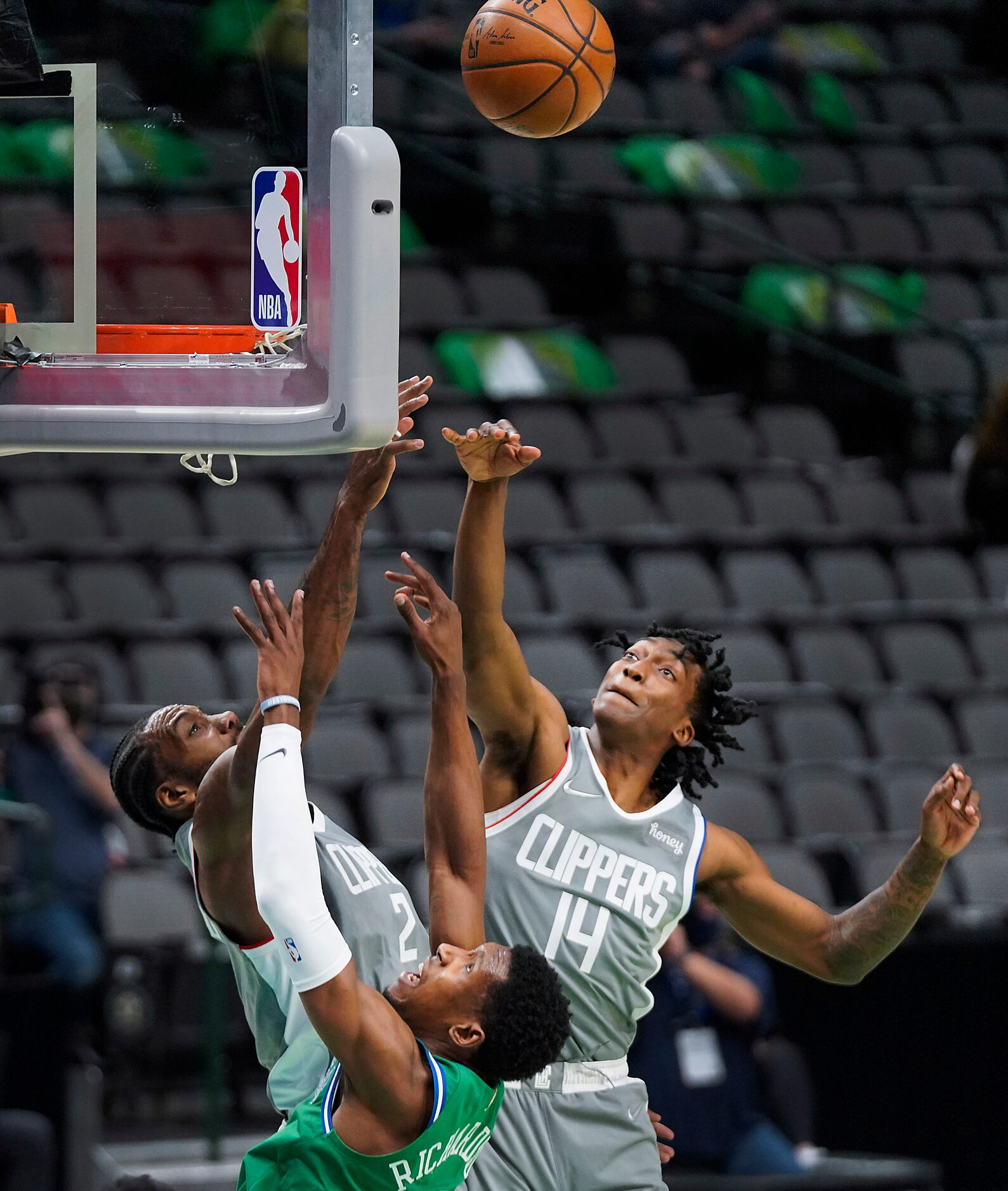 Dallas Mavericks guard Josh Richardson (0) puts up a shot a LA Clippers forward Kawhi...