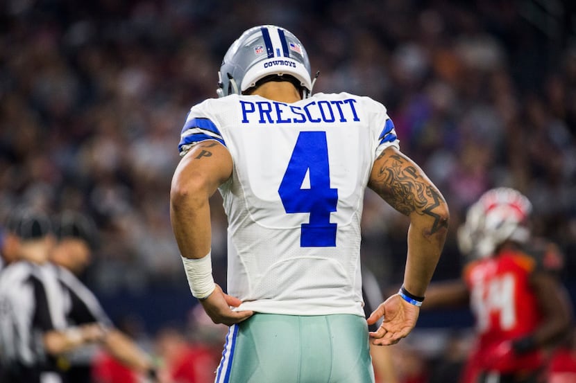 Dallas Cowboys quarterback Dak Prescott (4) takes the field during the fourth quarter of...