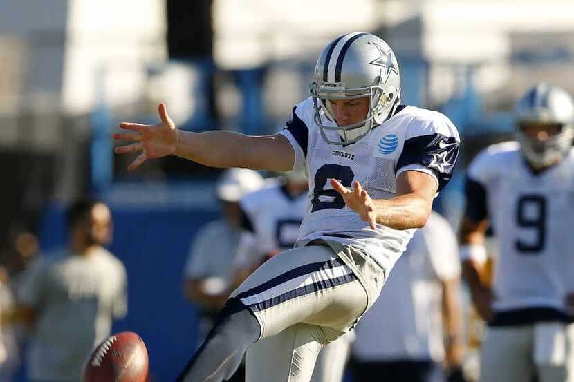 Dallas Cowboys punter Chris Jones (6) punts the ball away on fourth down during afternoon...