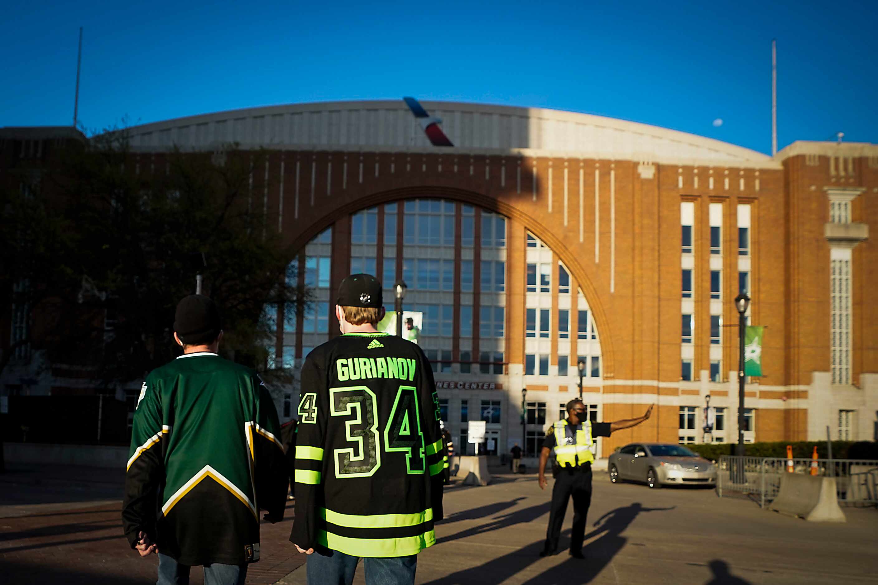 aDallas Stars fans head to the arena before an NHL hockey game against the Tampa Bay...