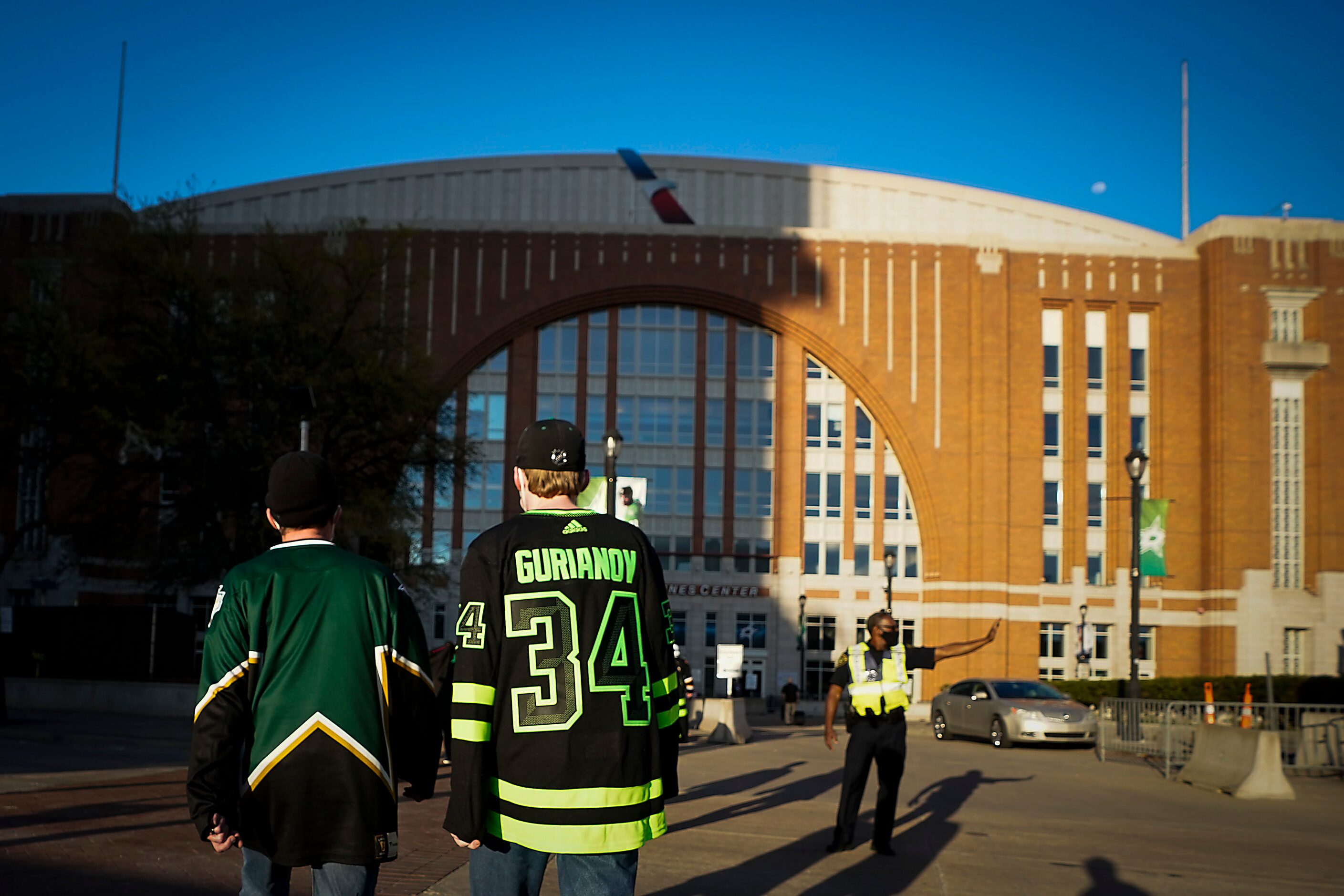 aDallas Stars fans head to the arena before an NHL hockey game against the Tampa Bay...