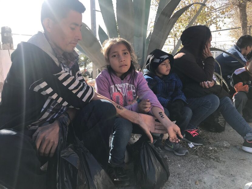 Mateo Mejia Hernandez, 30, and his 9-year-old daughter, Darleen, showed their processing...