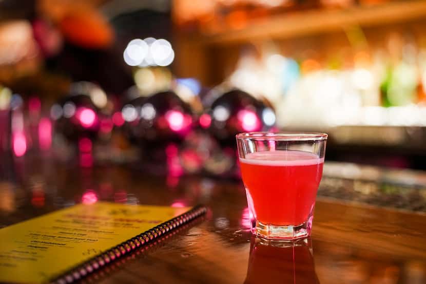 The Razzle Dazzle house shot, which combines raspberry-and-dill-infused vodka with lemon and...