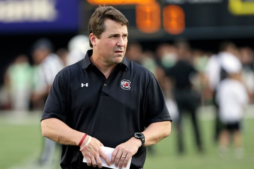 FILE - In this Sept. 1, 2016, file photo, South Carolina coach Will Muschamp watches players...