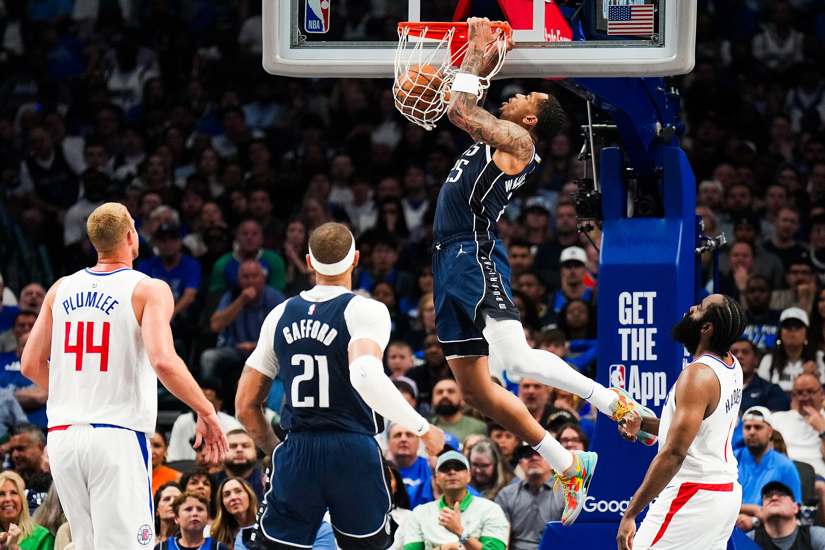 Dallas Mavericks forward P.J. Washington (25) dunks the ball past LA Clippers guard James...