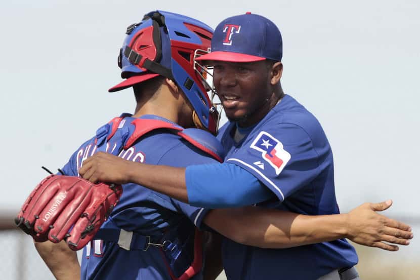 Neftali Feliz, right, thanks Texas Rangers catcher Robinson Chirinos after a pitching...