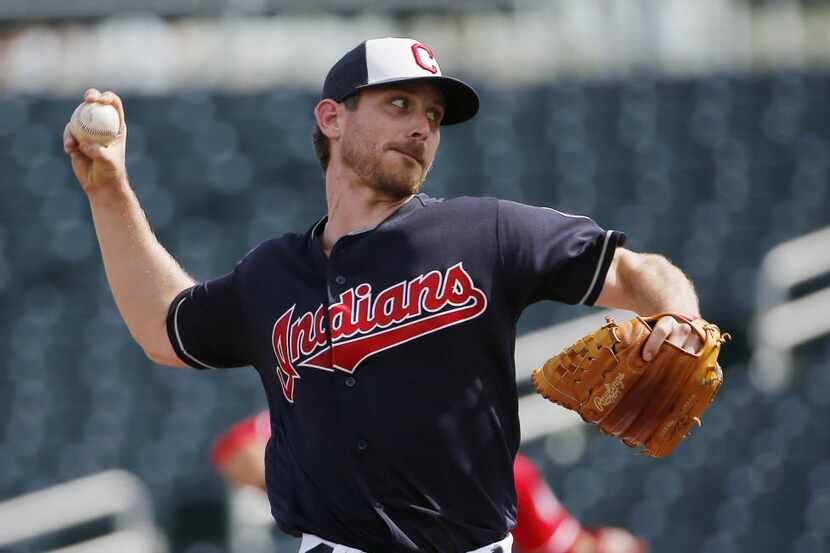 Cleveland Indians' Josh Tomlin throws a pitch during the first inning of a spring baseball...