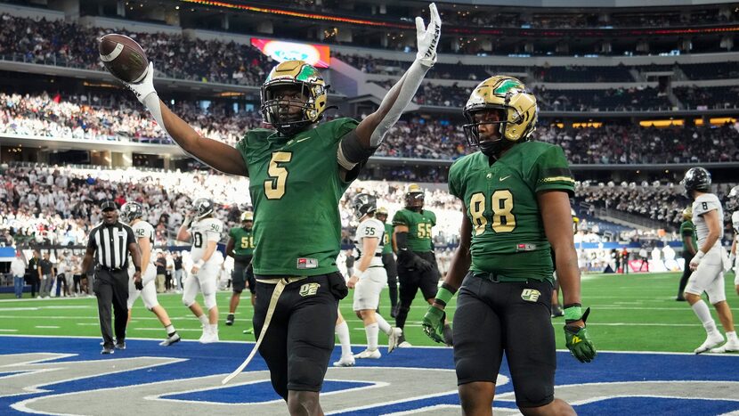 DeSoto running back Tre Wisner (5) celebrates after a touchdown during the first half of the...